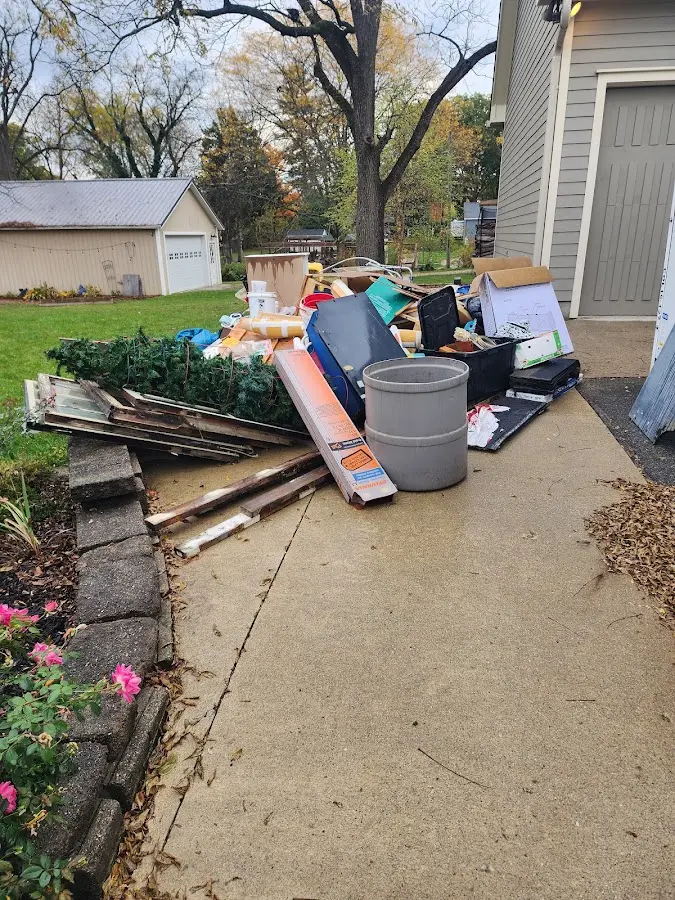 Dumpster being loaded with debris for Commercial Dumpster Rental in Weston